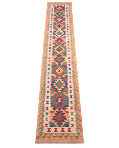 A 13ft long rectangular handwoven multicolour Kilim long runner rug with a vibrant geometric pattern in red, blue, green, and yellow on a beige background, bordered by peach-coloured edges.