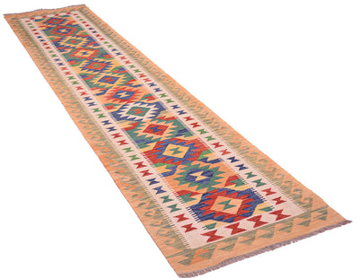 A 4m long rectangular multicolour kilim runner rug with a vibrant geometric pattern in orange, blue, green, red, and cream, shown diagonally on a plain white background.