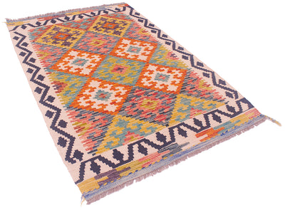 A 4x2'8 kilim Afghan rug with a vibrant geometric diamond pattern in orange, yellow, blue, pink, and purple on a cream background, featuring fringed edges.