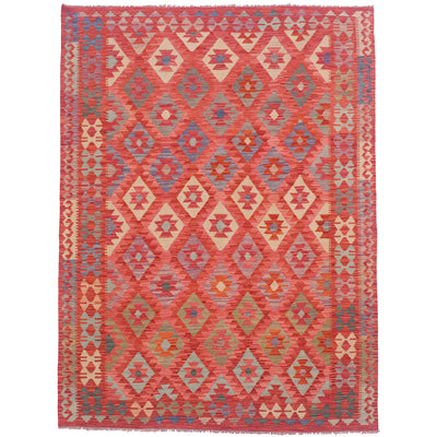 All over geometric design Afghan Veg Dye Kilim rug in colours of pink and red along with shades of beige, blue, turquoise and green.