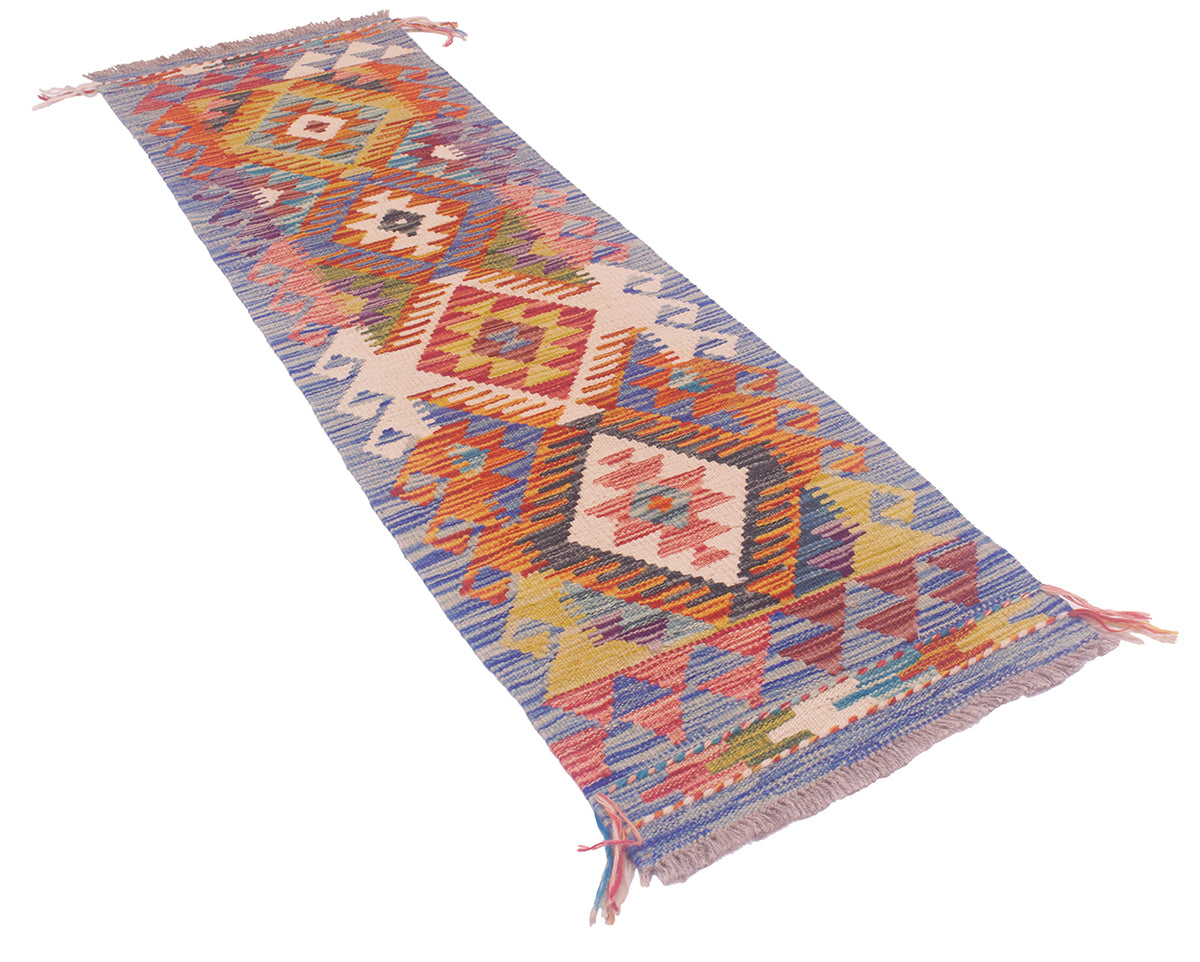 A narrow handwoven Afghan small Kilim Strip rug runner with a colourful geometric pattern, featuring fringe on both ends, displayed on a solid white background.