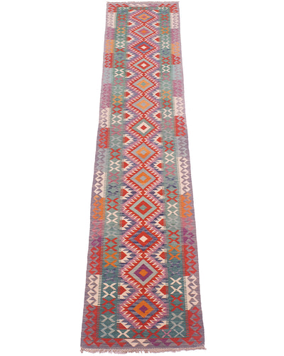 Colorful kilim runner rug with red orange blue geometric motifs and patterned border