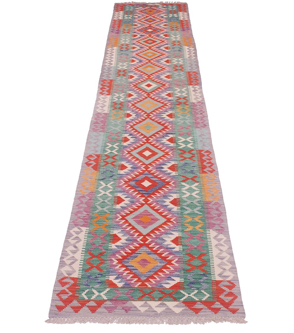 Colorful kilim runner rug with bold vertical medallions and multicolor border