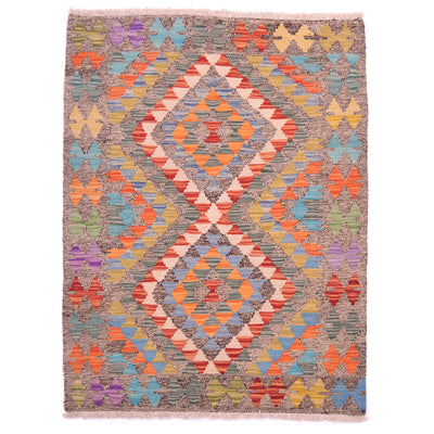 Afghan handwoven Kilim Rug: salt & pepper background / two-tone black and white with contrasting colourful geometric design.