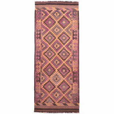 Vintage Afghan Kilim wide runner with mature colours of purples, brown, and ochre yellows.