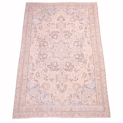 A rectangular vintage carpet with an intricate traditional floral pattern in softcreamy beige, light blue, dark and mid brown detailing. Classic oriental medallion shown flat against a white background.