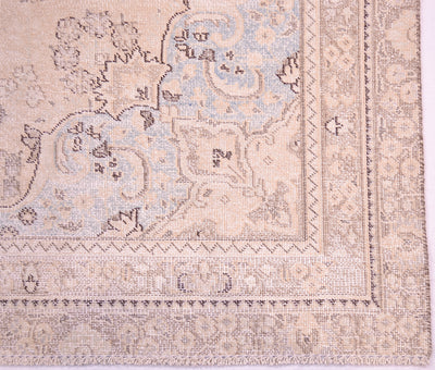 Corner and border of vintage handmade carpet with softened colours and shaved decolorised pile for enhanced vintage effect. Soft powder blues  in corner sprandrels. Highly floral border and geometric minor borders/gaurd stripes.