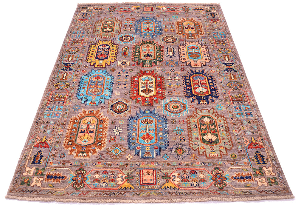 A rectangular Afghan Wazir rug with an intricate traditional pattern, featuring multiple central medallions and geometric borders in shades of blue, red, orange, beige, and brown on a grey background.