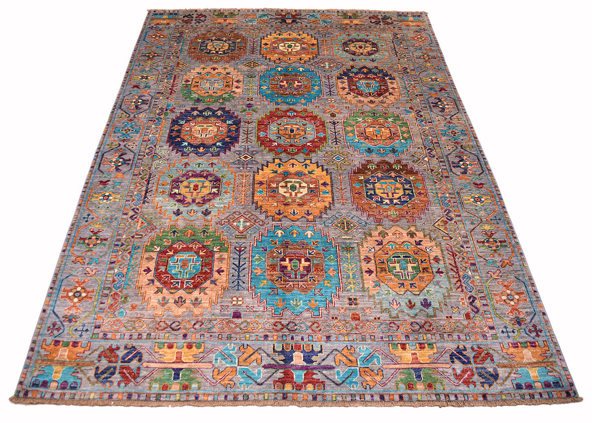 A handmade Afghan Waziri tribal rug with a traditional Turkmen-style design, featuring multiple colourful medallions and intricate geometric patterns on a muted grey background.