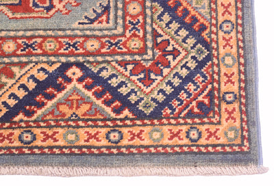 Handmade Afghan Yakash Kazak rug corner with border details and light fringed edge