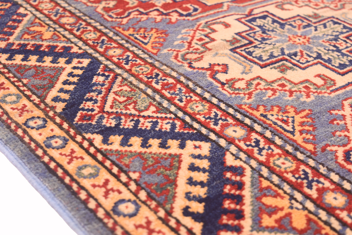 Handmade Afghan Yakash Kazak rug close-up of side band pattern with red and navy details