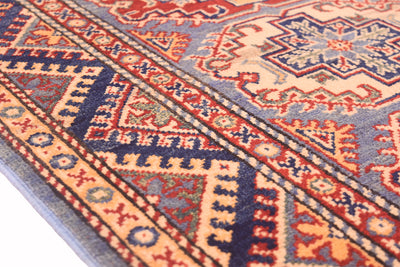 Handmade Afghan Yakash Kazak rug close-up of side band pattern with red and navy details