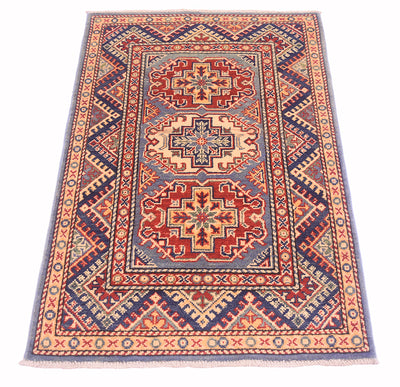 Handmade Afghan Yakash Kazak rug front view with repeating diamond motifs and red blue accents