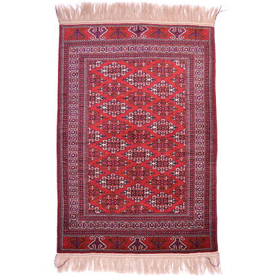 Hand-knotted Turkoman Yamoud Rug with design of kepse guls on a red ground.