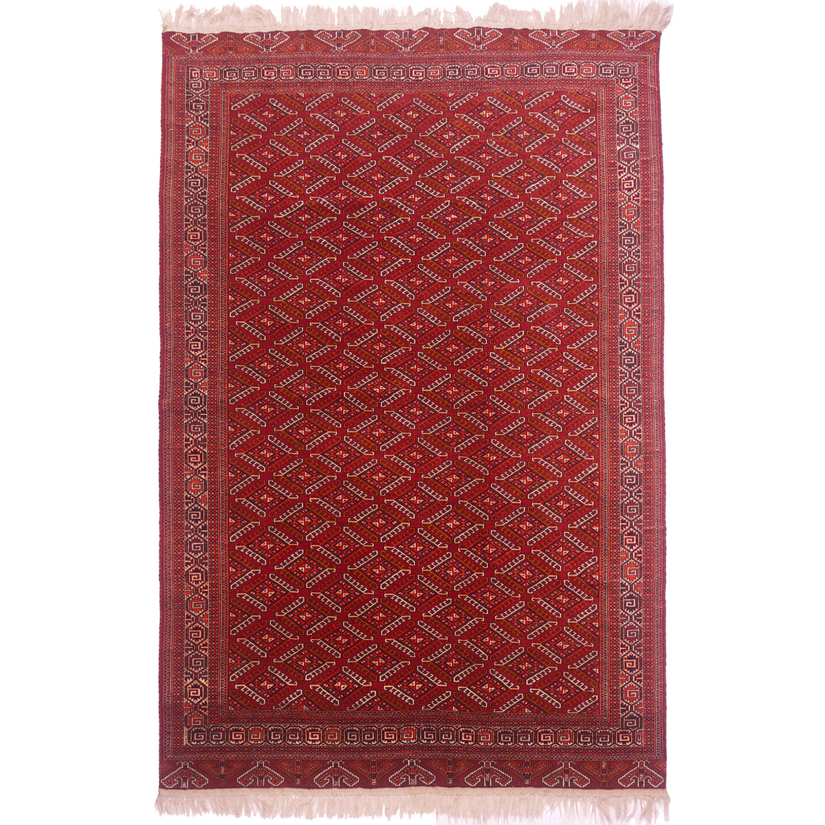 Old Turkoman Yamoud carpet with all over design of “dyrnak” guls on a red field.