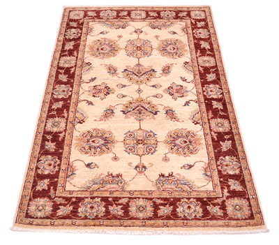 Accents of blue and pink terracotta with golden yellow secondary colours. Cream ivory field colour and pure wool pile.