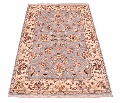 Floral border and main field of afghan ziegler rug with cream motifs and punctiations of pinks, red and golden tones