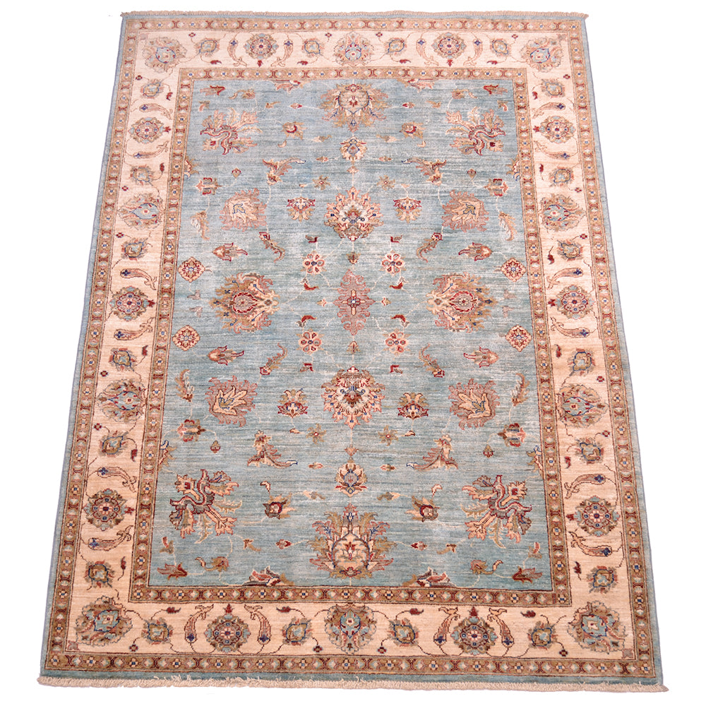 All over floral design with light topaz blue field and handknotted pure wool pile