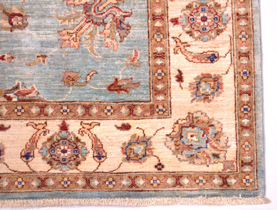Border and corner detail of handwoven carpet with cotton warp fringes and natural vegetable dyes