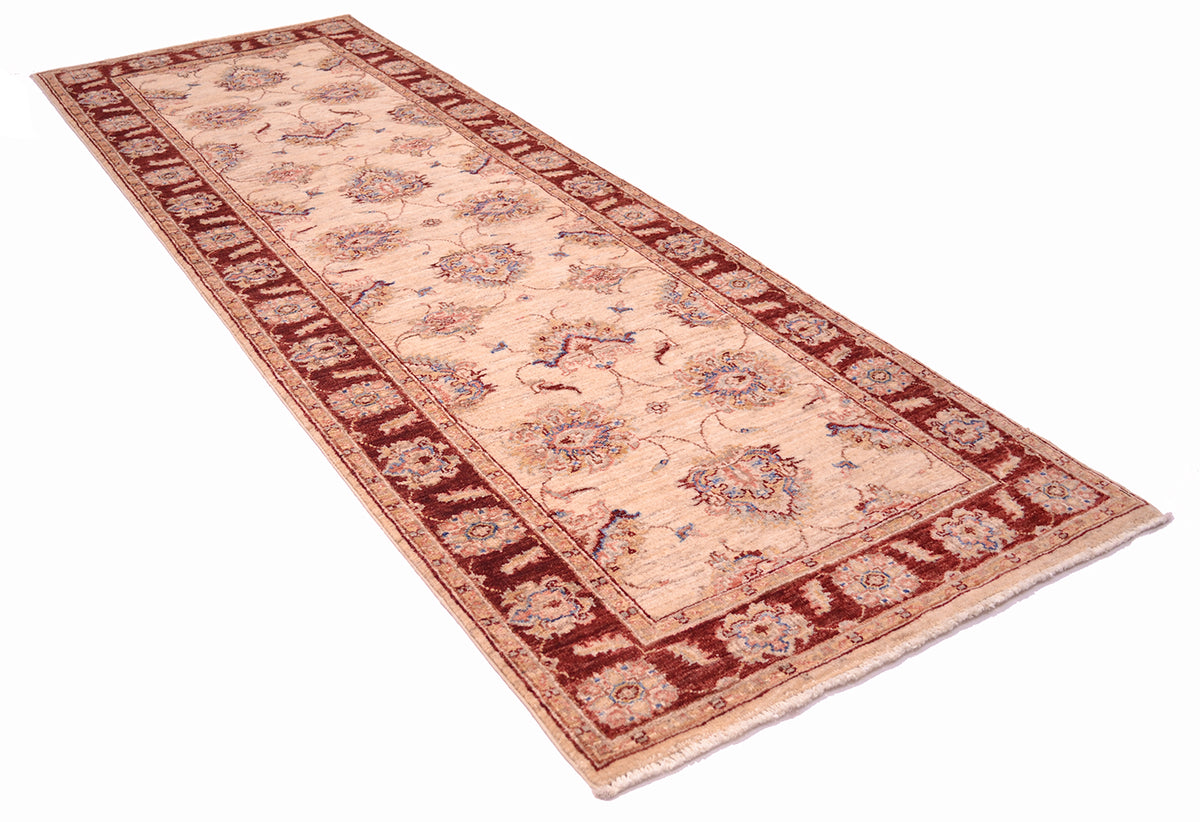 Angled view of classic design of Ziegler Runner with cream and amber red border. Pure wool pile with natural vegetable dyes.