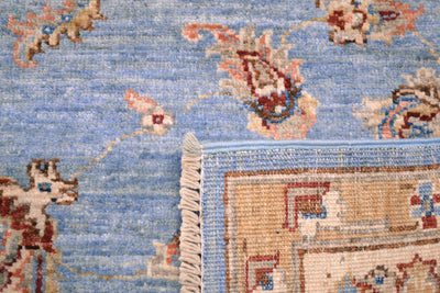 Details showing back of Afghan Ziegler handwoven carpet and colours of light blue pure wool pile.