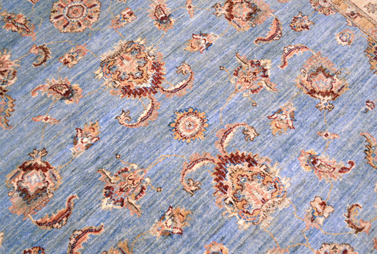Detail of main decorative field of Afghan Ziegler Carpet with spacious palmette, flowers and leaves.