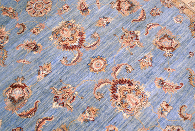 Detail of main decorative field of Afghan Ziegler Carpet with spacious palmette, flowers and leaves.