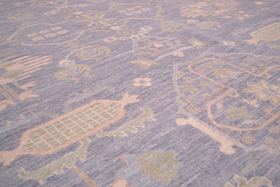 Close-up of pastel blue rug surface with geometric lines and soft motif shapes