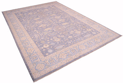 Pastel blue patterned area rug laid diagonally with ornate border