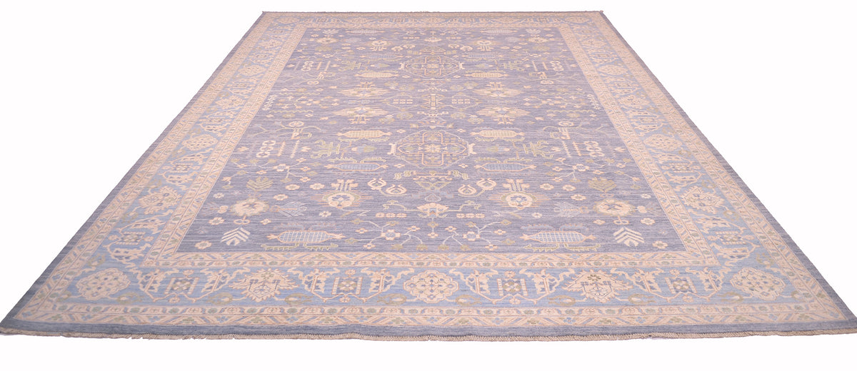 Pastel blue patterned area rug with thin border and scattered motif field