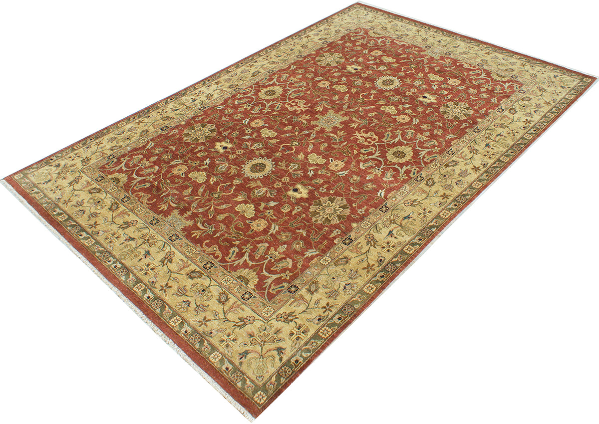 Angled view of handknotted roomsize carpet with Autumnal Colours and an ornate floral field filled with rosettes, leaves and palmettes.