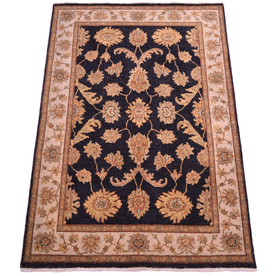 Floral area rug with dark navy center, tan border, and gold-rust medallion accents