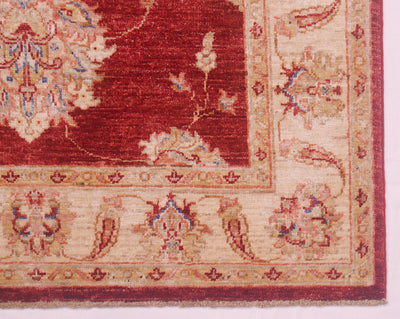 Border and corner of Afghan Ziegler rug with floral palmettes and blossoms.