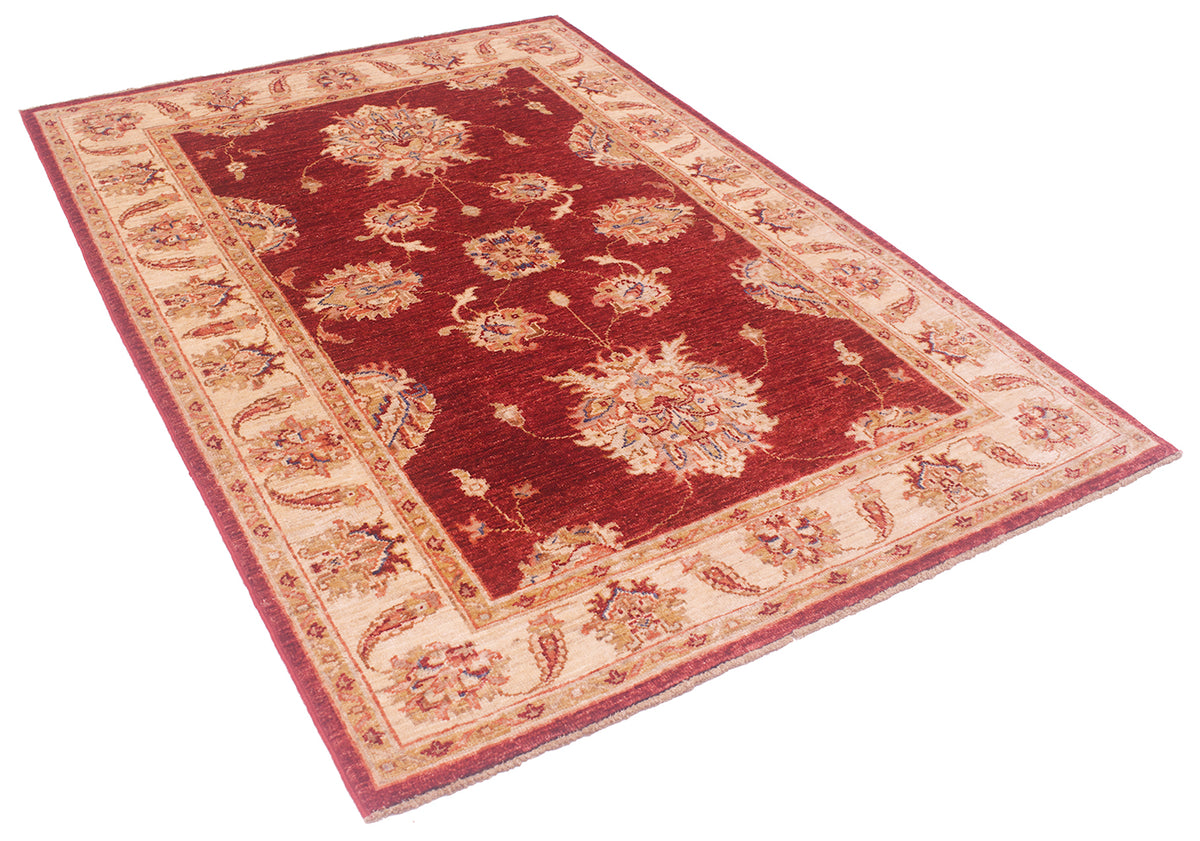 Elegant angled view of handwoven Afghan Rug with cream, gold, red and beige.