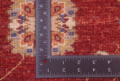 Reverse of handknotted rug in red, cream and gold. Fine weaving with natural vegetable dyes.