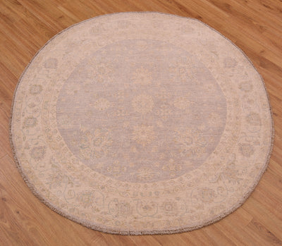 Beautiful handmade Afghan Ziegler Circle Rug with soft colours of grey with beige in a hard-to-find circular rug size.