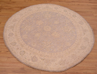 Beautiful handmade Afghan Ziegler Circle Rug with soft colours of grey with beige in a hard-to-find circular rug size.