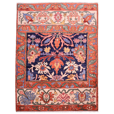 Antique floral area rug with navy, orange, and cream medallion design and ornate border.