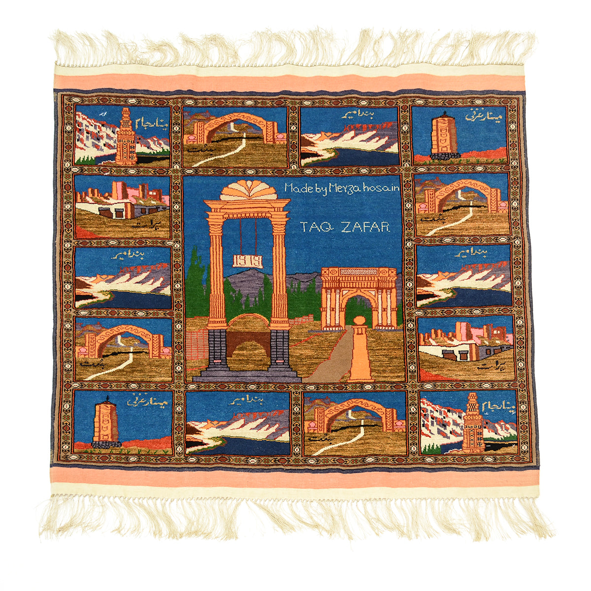 A hand-knotted Fine Pictorial Afghan rug wool and silk pile featuring a grid of architectural scenes from Afghanistan, including arches, mountains, and minarets, with cream fringe on the top and bottom. The centre panel reads 'Made by Meyza Hosain TAQ ZAFAR'.