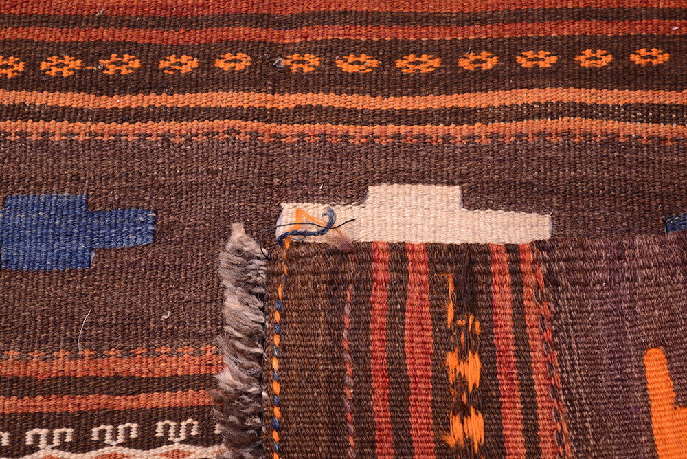 Qala-i-Nau kilim rug close-up showing woven texture and fringe in orange and blue